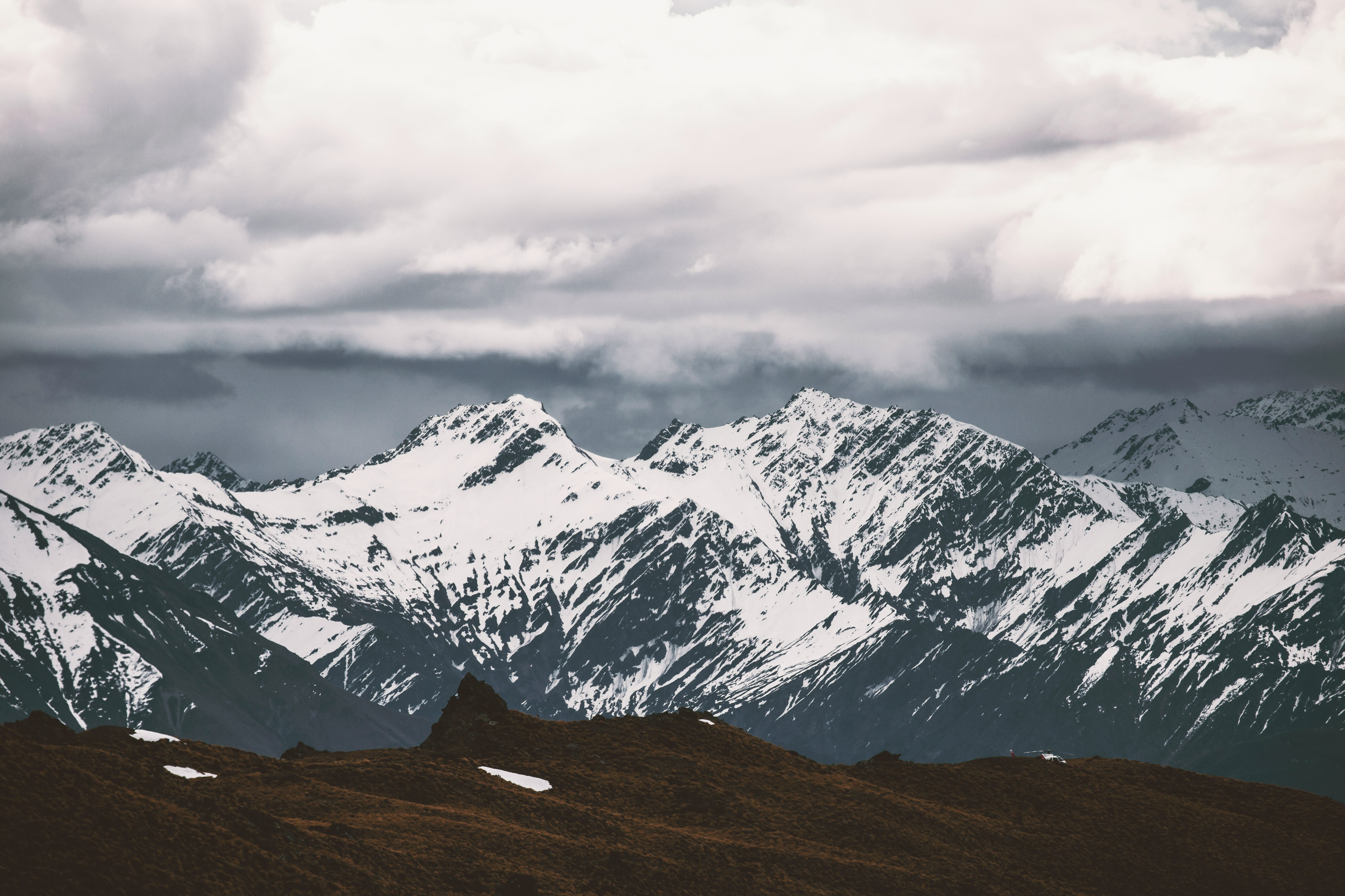 selective focus photography of mountain covered by snow